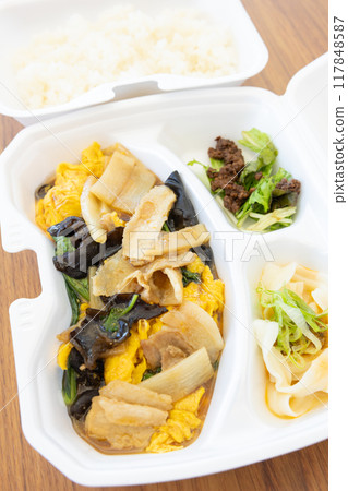 Delicious Chinese food, fried pork and egg bento Delicious Chinese food, fried pork and egg bento 117848587