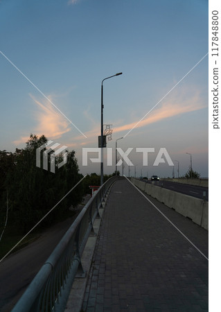 Sunset clear sky on a car bridge 117848800