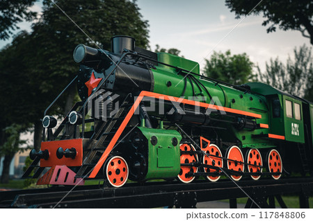 A small model of an old steam locomotive in the city of Baranovichi 117848806