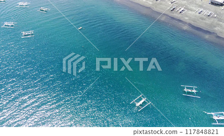 Aerial view of a peaceful Cemare beach in Lombok, Indonesia. Aerial view of a peaceful Cemare beach in Lombok, Indonesia. 117848821
