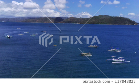 Aerial view of a peaceful Cemare beach in Lombok, Indonesia. Aerial view of a peaceful Cemare beach in Lombok, Indonesia. 117848825