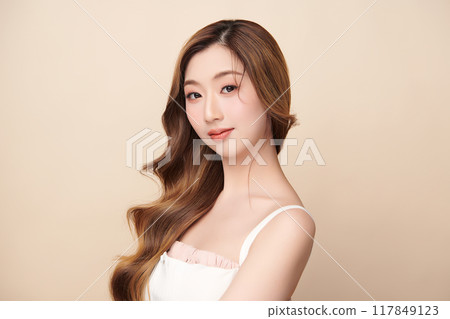 Beautiful young asian woman with clean fresh skin on beige background, Face care, Facial treatment, Cosmetology, beauty and spa, Asian women portrait. Beautiful young asian woman with clean fresh skin on beige background, Face care, Facial treatment, Cosmetology, beauty and spa, Asian women portrait. 117849123