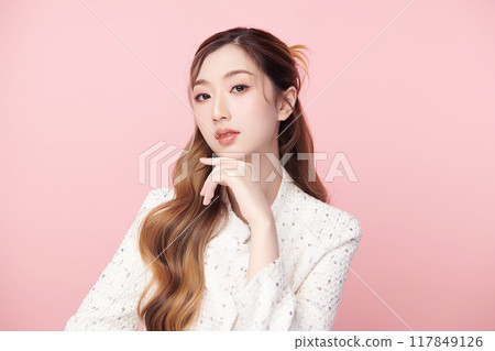 Beautiful young asian woman with clean fresh skin on pink background, Face care, Facial treatment, Cosmetology, beauty and spa, Asian women portrait. 117849126