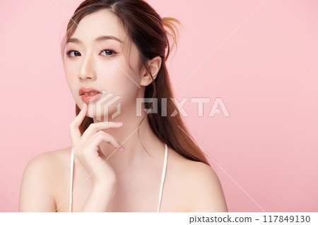Beautiful young asian woman with clean fresh skin on pink background, Face care, Facial treatment, Cosmetology, beauty and spa, Asian women portrait. 117849130