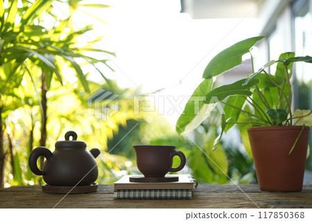 Brown wooden Tea cup and earthenware teapot at the balcony chilling outdoor relaxing 117850368