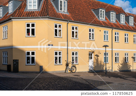 Praesto, Seeland, Denmark - Facade of colorful houses in the village center Praesto, Seeland, Denmark - Facade of colorful houses in the village center 117850625
