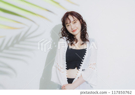 Young woman at summer resort Young woman at summer resort 117850762