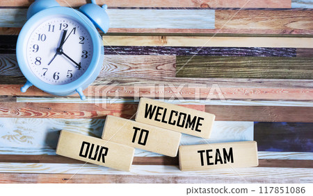 Welcome to our team symbol. Concept words Welcome to our team on wooden blocks. Welcome to our team symbol. Concept words Welcome to our team on wooden blocks. 117851086