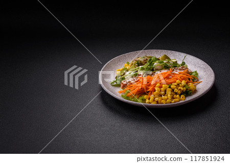 Fresh juicy salad with meat, mozzarella, carrots, lettuce, corn 117851924