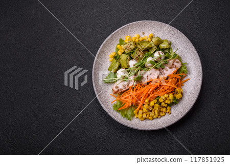 Fresh juicy salad with meat, mozzarella, carrots, lettuce, corn 117851925