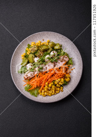 Fresh juicy salad with meat, mozzarella, carrots, lettuce, corn 117851926