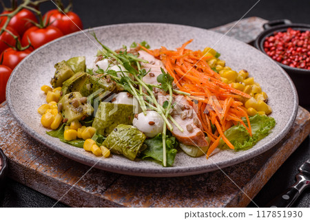 Fresh juicy salad with meat, mozzarella, carrots, lettuce, corn 117851930
