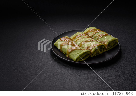 Spinach Crepes stuffed with chicken, mushrooms, salt and spices 117851948