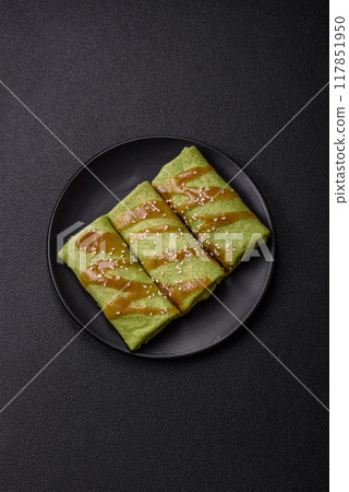 Spinach Crepes stuffed with chicken, mushrooms, salt and spices Spinach Crepes stuffed with chicken, mushrooms, salt and spices 117851950