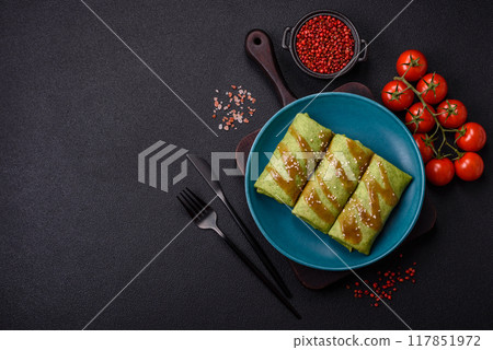 Spinach Crepes stuffed with chicken, mushrooms, salt and spices 117851972