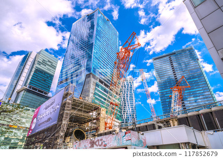 Tokyo cityscape in Japan - View of Shibuya Station redevelopment and large cranes from Shibuya Hachiko Square (August 20th) 117852679