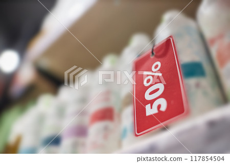 Low angle shot of red price tag for cosmetic products Low angle shot of red price tag for cosmetic products 117854504