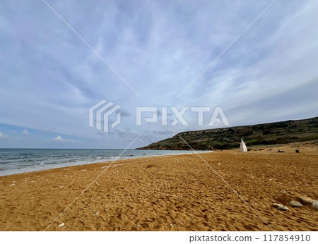 Beautiful sandy beach on the Coast of the island of Gozo, Malta. The Mediterranean Sea. Beautiful sandy beach on the Coast of the island of Gozo, Malta. The Mediterranean Sea. 117854910