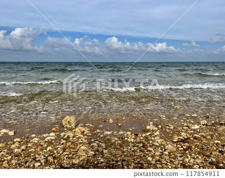 Beautiful sandy beach on the Coast of the island of Gozo, Malta. The Mediterranean Sea. Beautiful sandy beach on the Coast of the island of Gozo, Malta. The Mediterranean Sea. 117854911