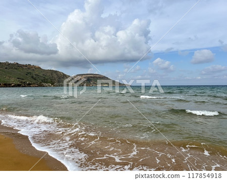 Beautiful sandy beach on the Coast of the island of Gozo, Malta. The Mediterranean Sea. 117854918
