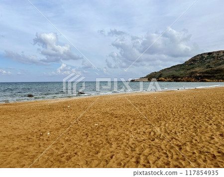 Beautiful sandy beach on the Coast of the island of Gozo. Beautiful sandy beach on the Coast of the island of Gozo. 117854935