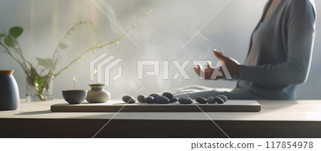 Person Sitting at Table With Vase and Candle 117854978