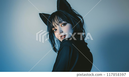 Halloween cosplay of a Japanese woman dressed as a black cat 117858397