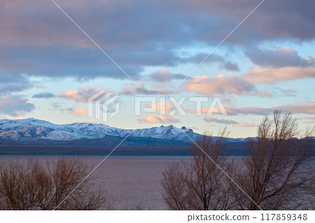 Evening sky over lake and trees Evening sky over lake and trees 117859348