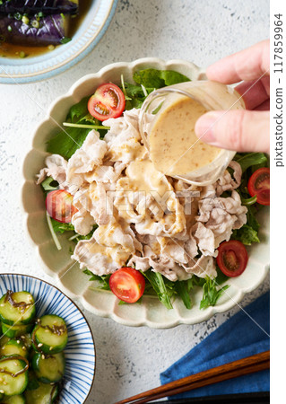 Cold pork belly salad with sesame sauce 117859964