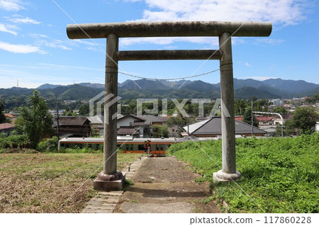 View of the Itsukaichi Line train from the torii gate of Sannai Shrine View of the Itsukaichi Line train from the torii gate of Sannai Shrine 117860228