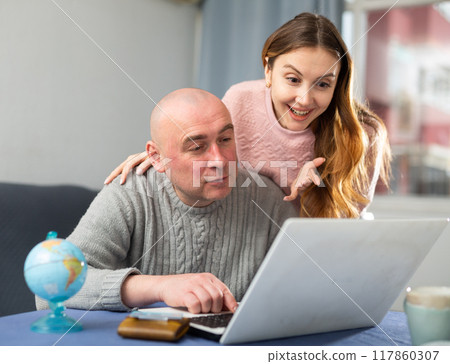 Wife and husband planning travel together 117860307