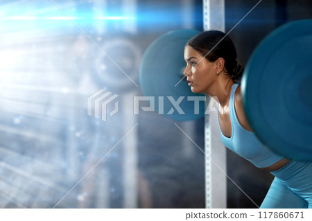 Young woman lifting barbell in gym 117860671