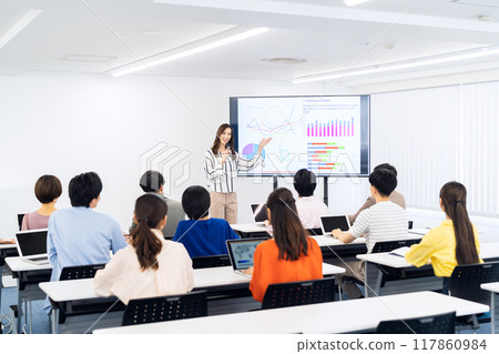 Young men and women receiving a seminar 117860984