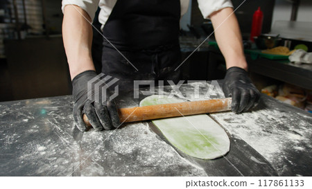 The Effort Of A Chef Using The Rolling Pin The Effort Of A Chef Using The Rolling Pin 117861133