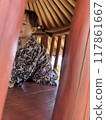 Girl playing with wooden playground equipment 117861667