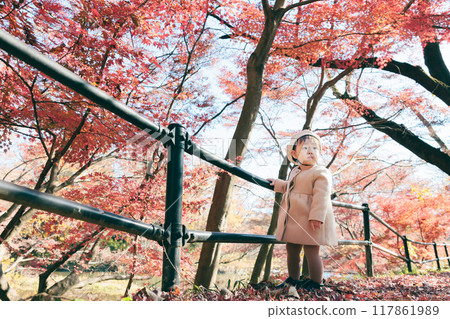 1 year old playing in the autumn park 117861989