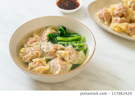 pork wonton soup or pork dumplings soup with vegetable 117862429