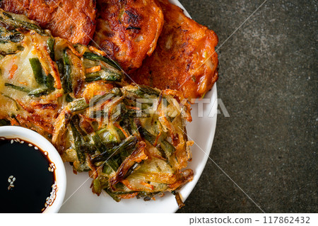 Pajeon or Korean pancake and Korean Kimchi pancake or Kimchijeon on white background 117862432