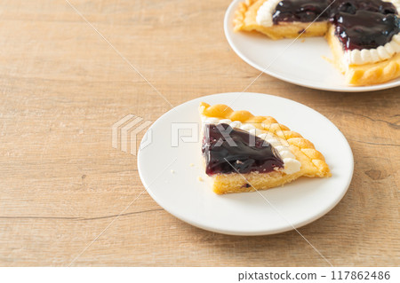 Blueberry Cheese Pie on white plate Blueberry Cheese Pie on white plate 117862486