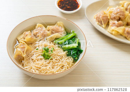 egg noodles with pork wonton soup or pork dumplings soup and vegetable 117862528