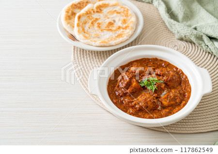 chicken tikka masala spicy curry meat food with roti or naan bread chicken tikka masala spicy curry meat food with roti or naan bread 117862549