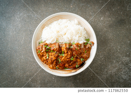 chicken tikka masala with rice on plate 117862550