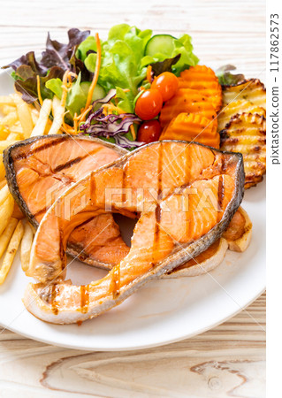 grilled salmon steak fillet with vegetable and french fries 117862573