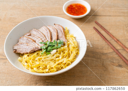 dried duck noodles in white bowl 117862650