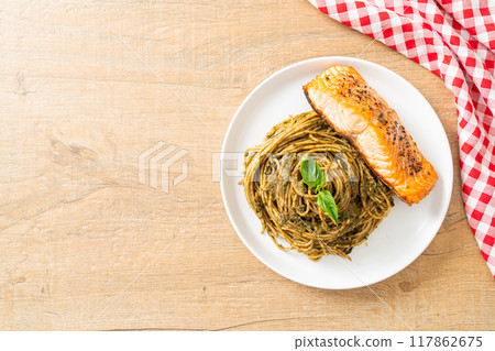 pesto spaghetti pasta with grilled salmon 117862675