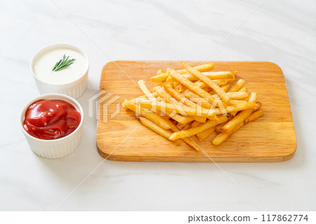 French fries with sour cream and ketchup 117862774