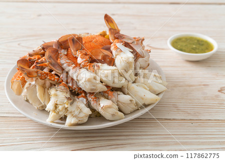 Steamed blue crab with spicy seafood sauce Steamed blue crab with spicy seafood sauce 117862775