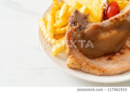 pork chop steak with chips and mini salad pork chop steak with chips and mini salad 117862910