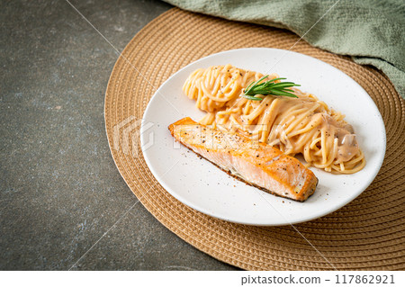 grilled salmon with spaghetti creamy tomato sauce 117862921