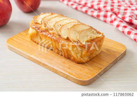 apple loaf crumbled on wood board 117863062